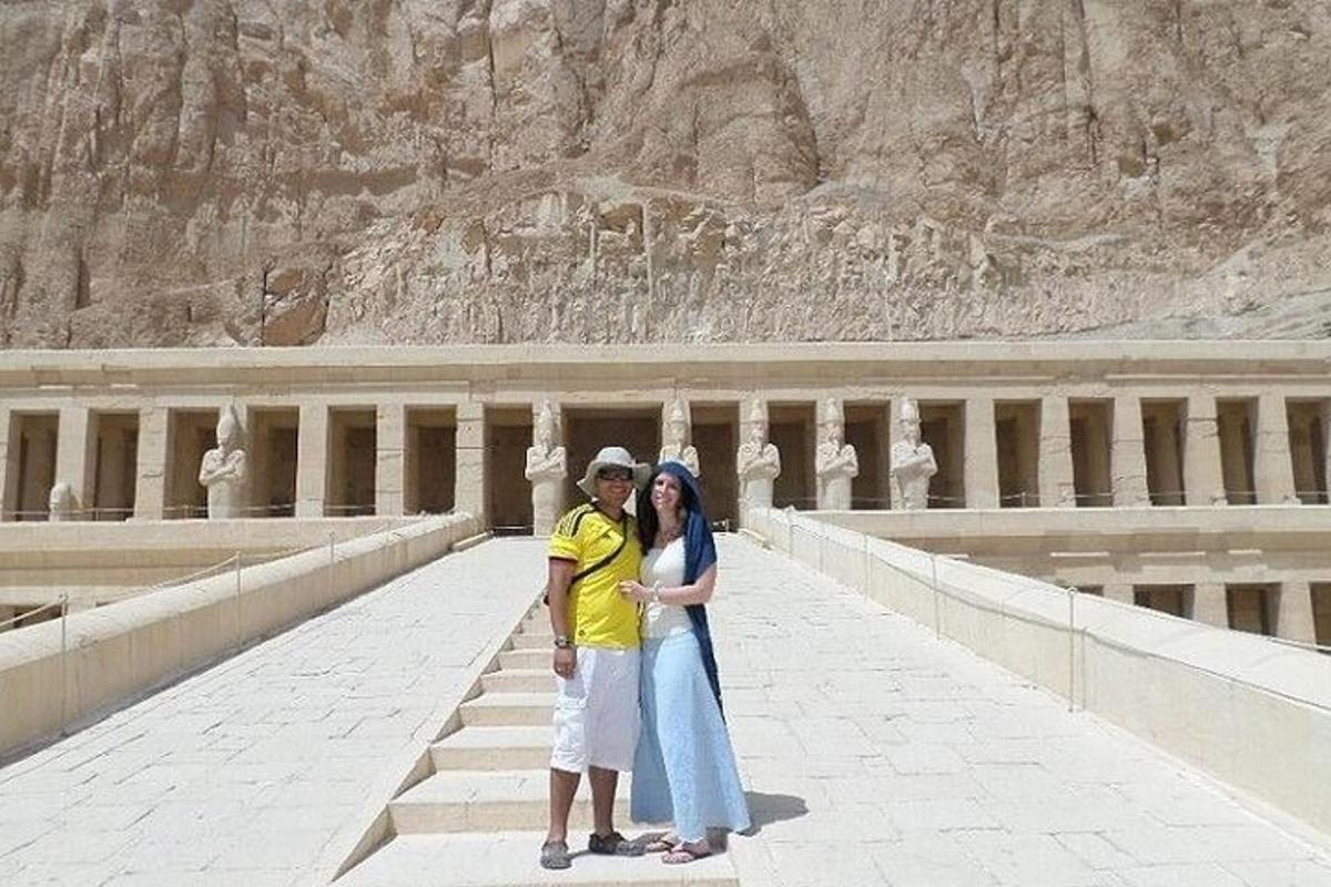 a man and a woman standing on a bridge