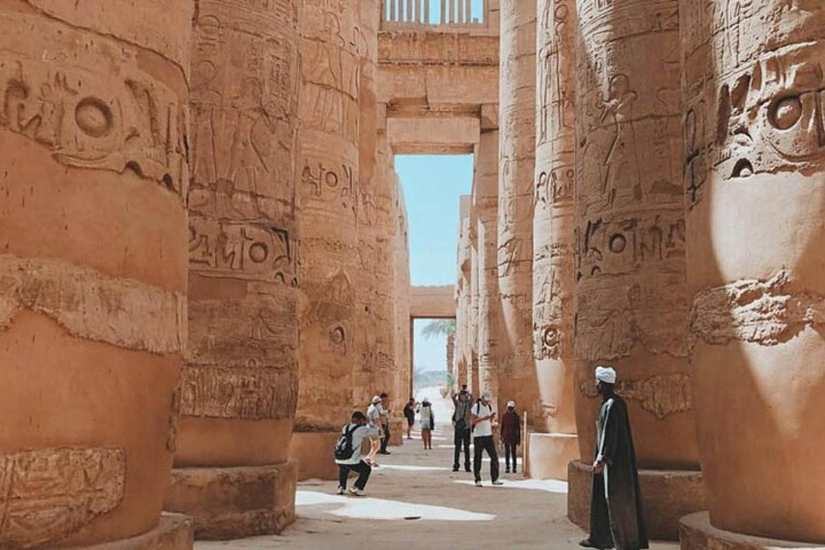a group of people walking through an ancient ruins