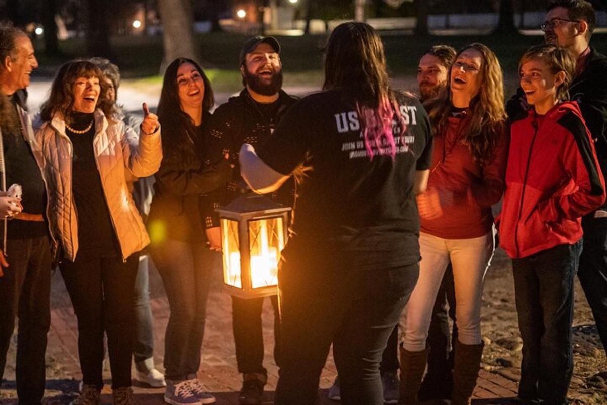 a group of people standing next to a lit candle