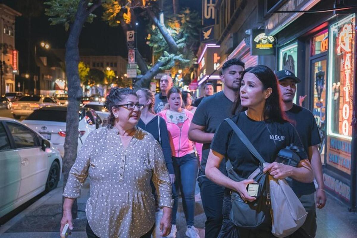 a group of people walking down a city street