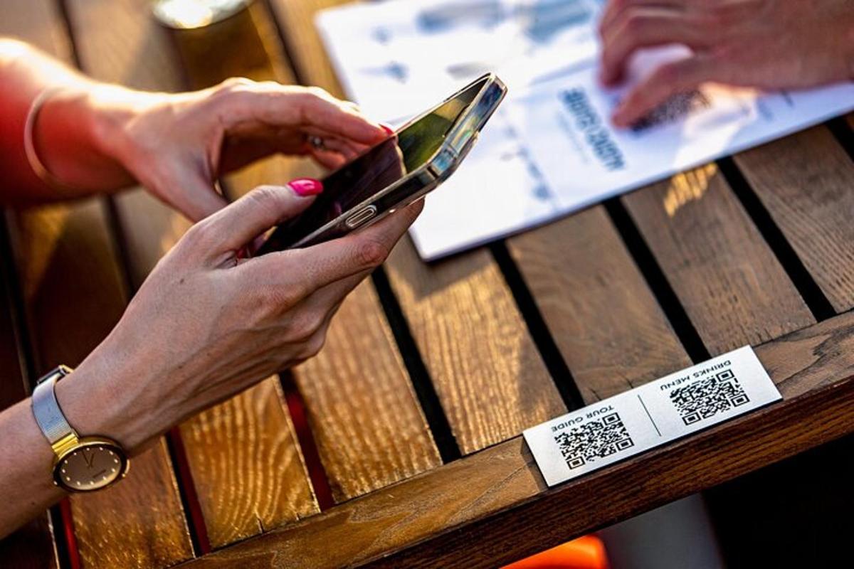 a woman using her cell phone on a picnic table