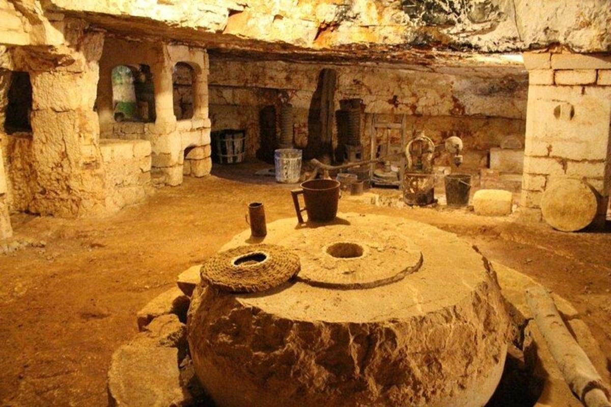 a room with a stone stove in a cave