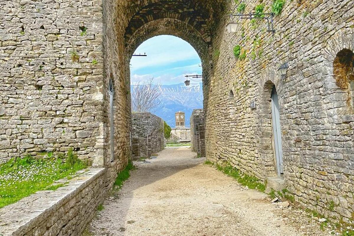 an alley in an old stone building with an archway