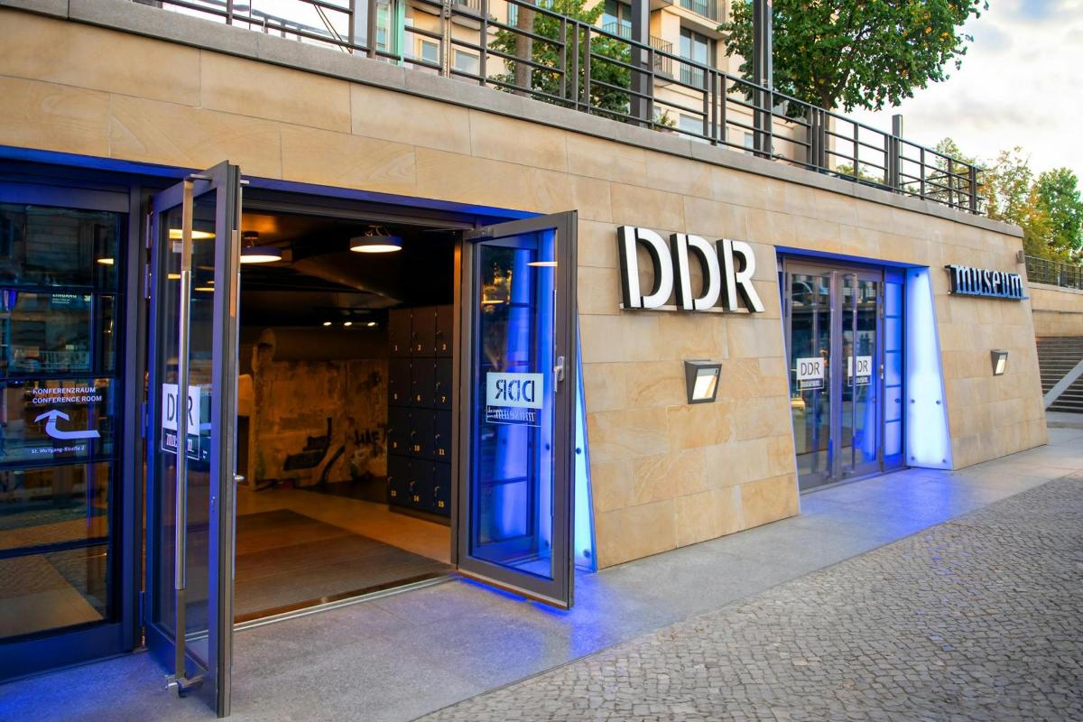 a store front with doors open on a building