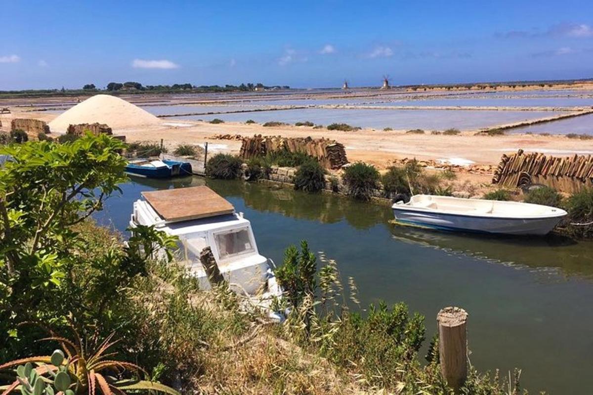 a boat in the water next to a beach