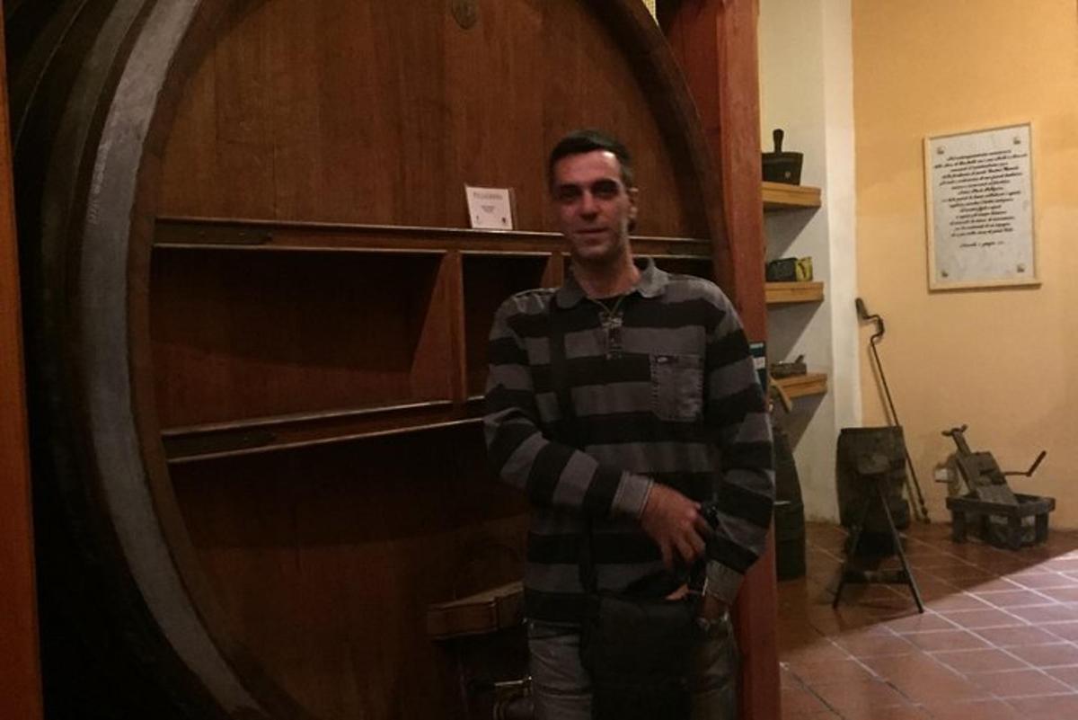 a man standing in front of a wooden door