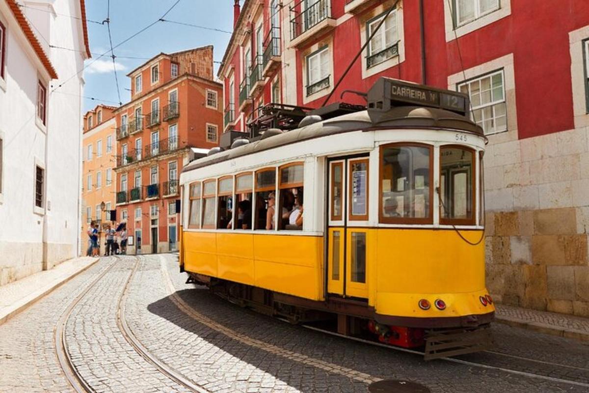 a yellow trolley car on a city street