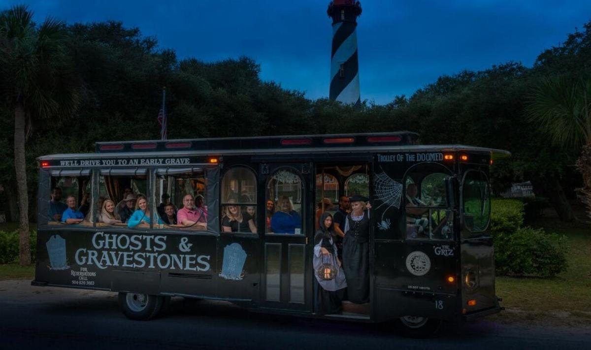 a trolley car with people riding in it