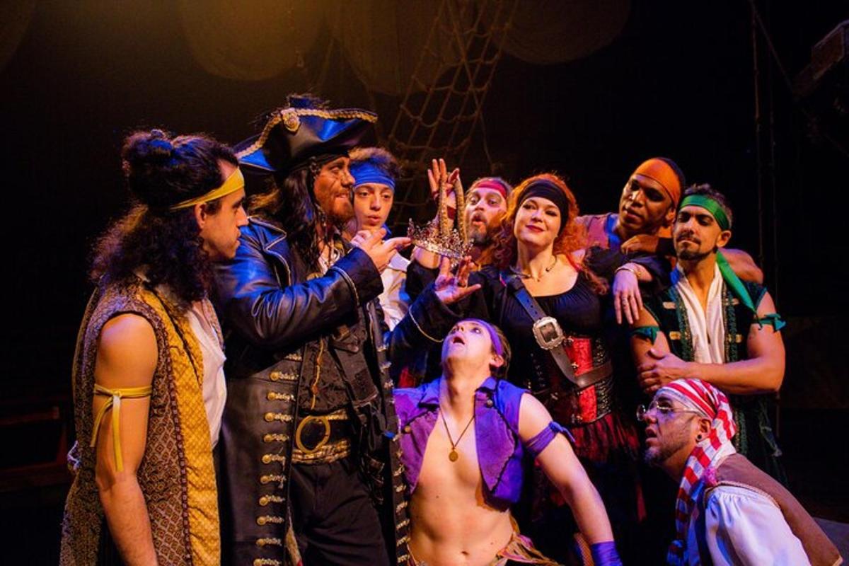 a group of people posing for a picture on a stage