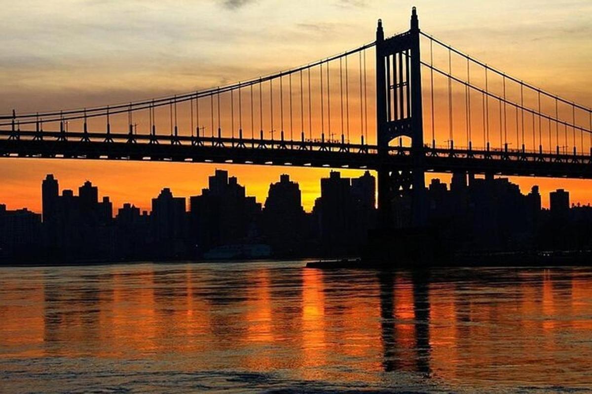a bridge over the water in front of a city
