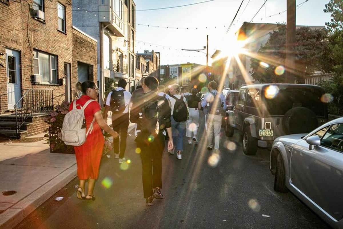 a group of people walking down a city street