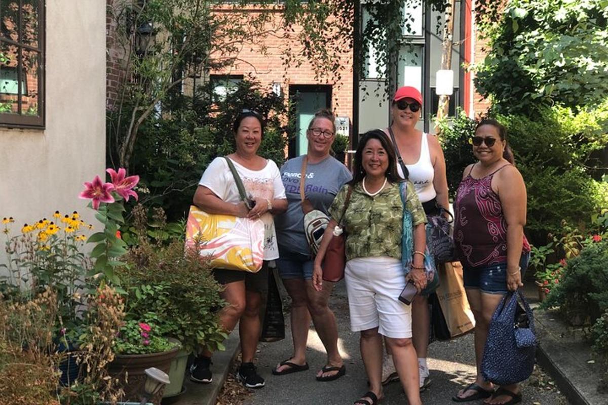 a group of people standing in front of a house