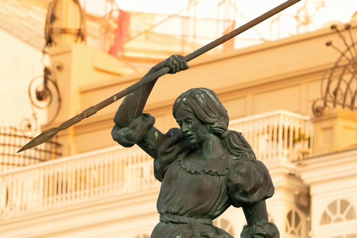 a statue of a woman holding a spear