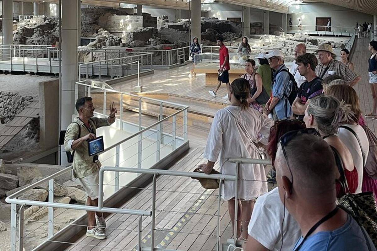 a group of people in a museum looking at fossils