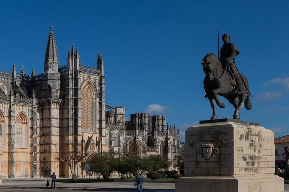 a statue of a man on a horse in front of a building