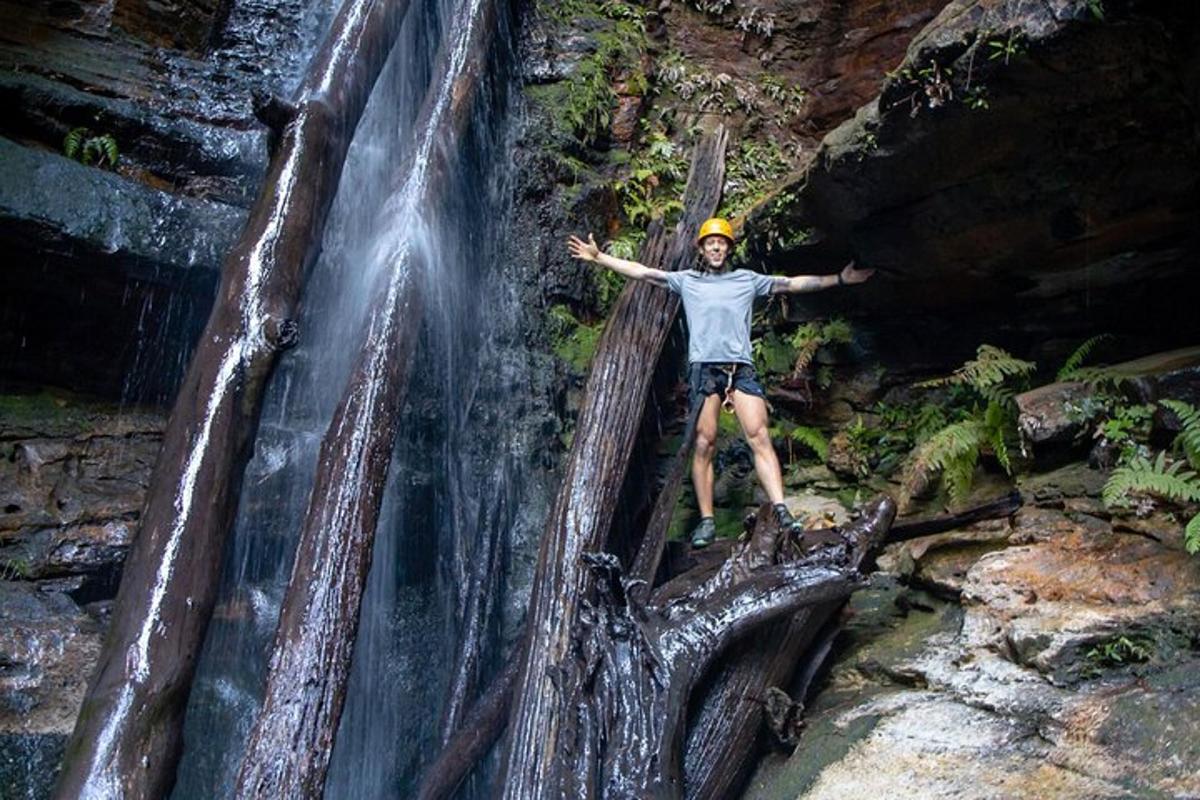 a man standing on top of a waterfall
