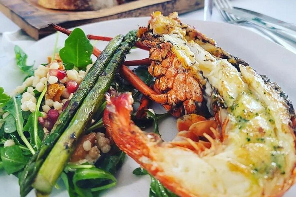 a plate of food with seafood and a salad