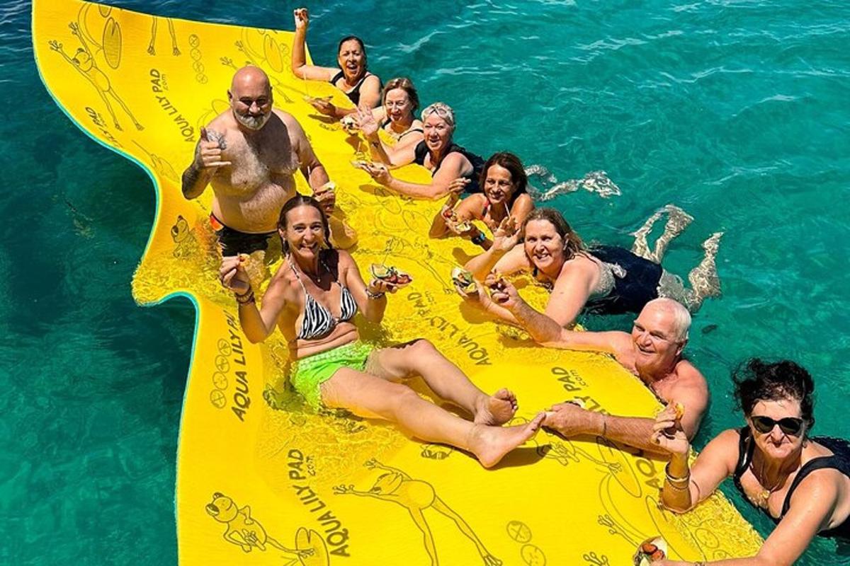 a group of people in the water on an inflatable raft