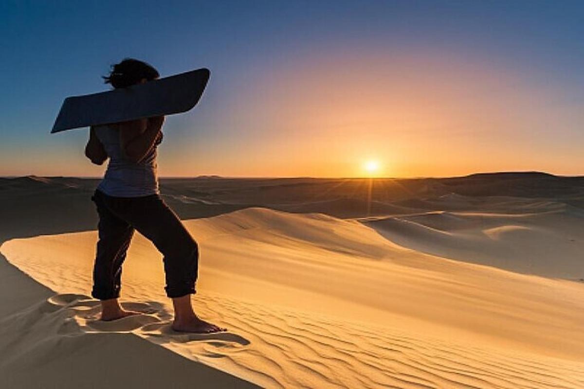 a person holding a surfboard in the desert