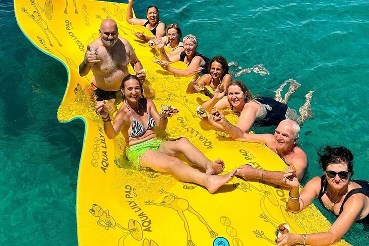a group of people in the water on an inflatable raft