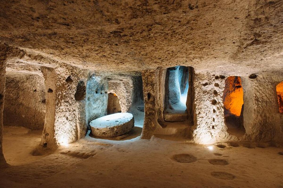 a small room with some windows in a cave