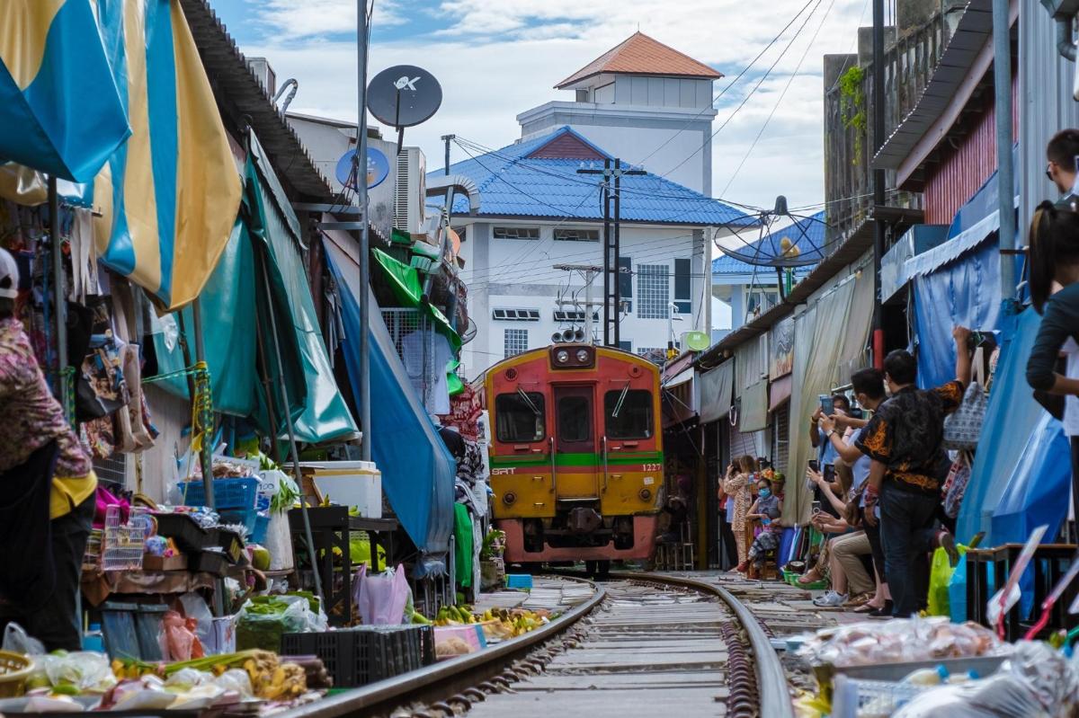 a train is coming down the tracks in a market