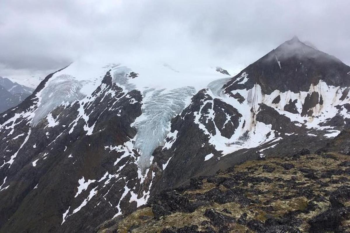 a mountain covered in snow and ice on a mountain