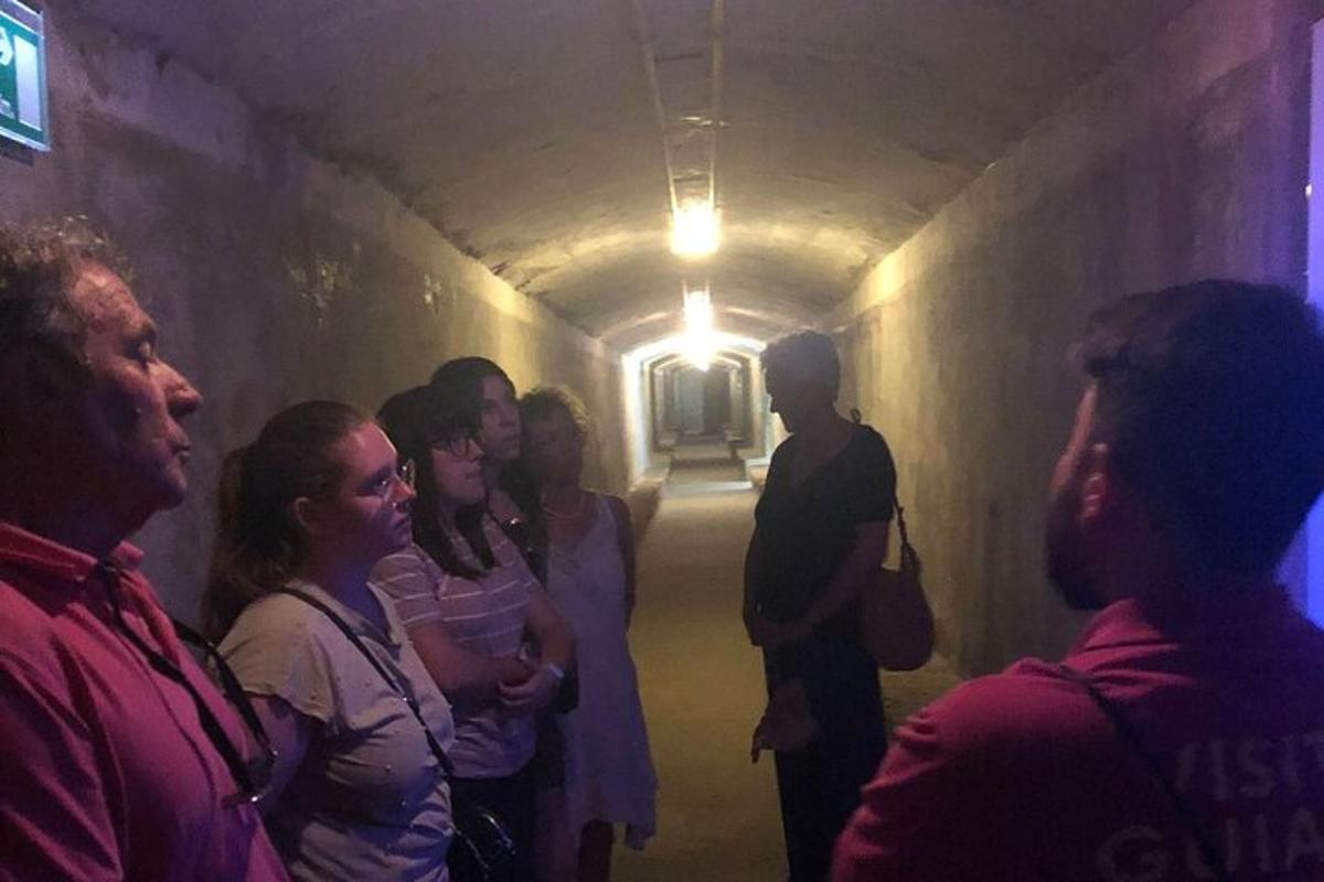 a group of people standing in a tunnel