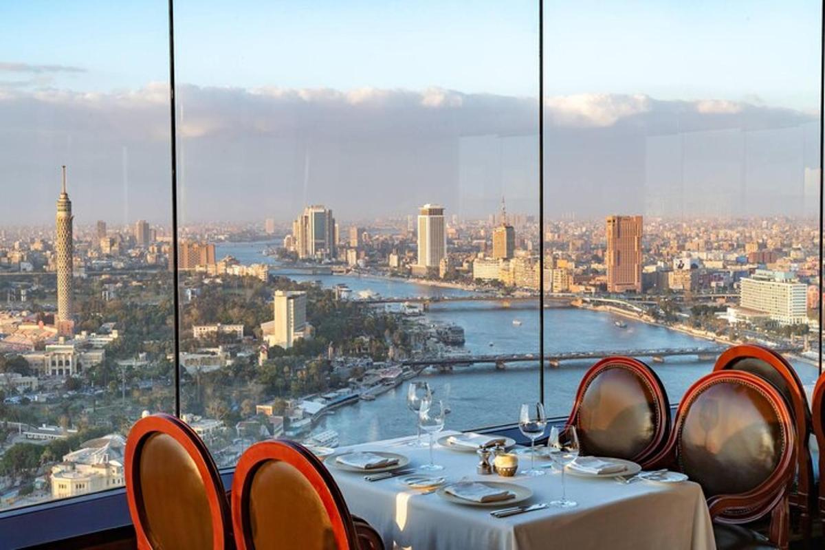 a table in a restaurant with a view of a city