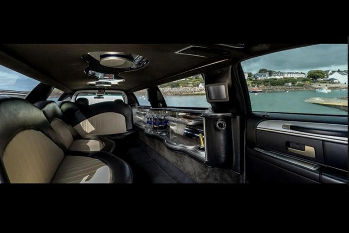 a view from the backseat of a car looking out at the water