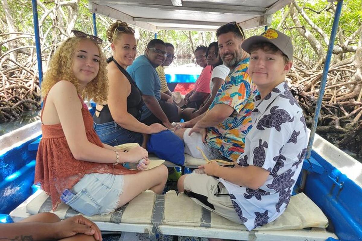 a group of people sitting in the back of a boat