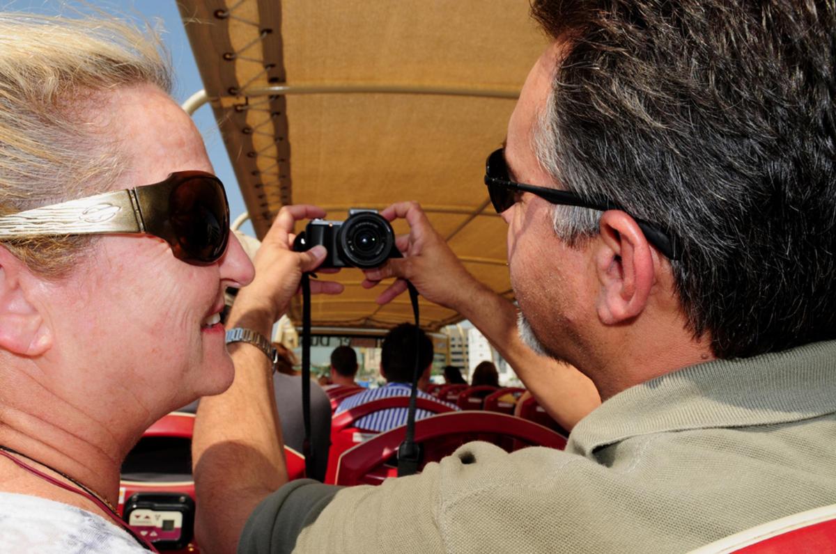 a man taking a picture of a woman with a camera