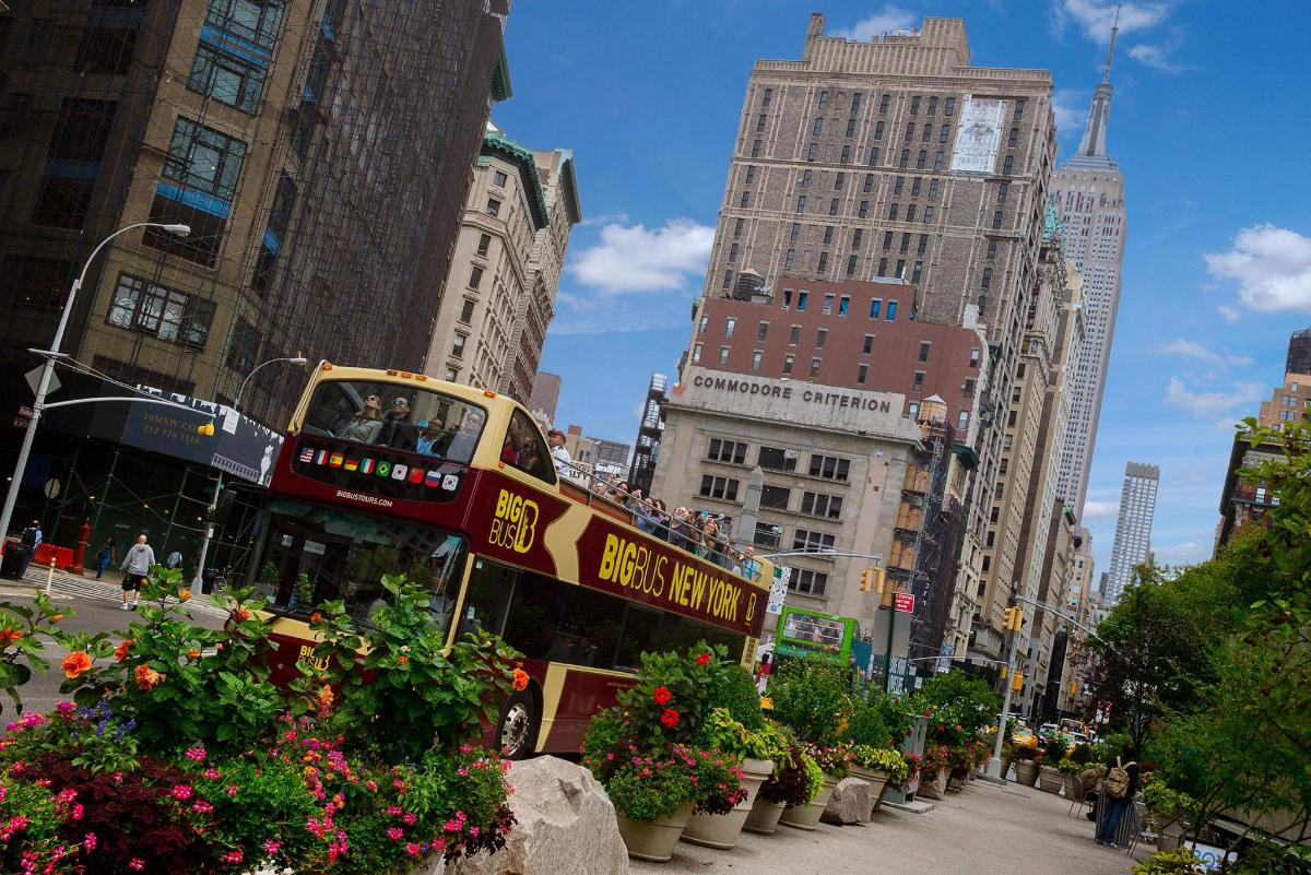 a double decker bus driving down a city street
