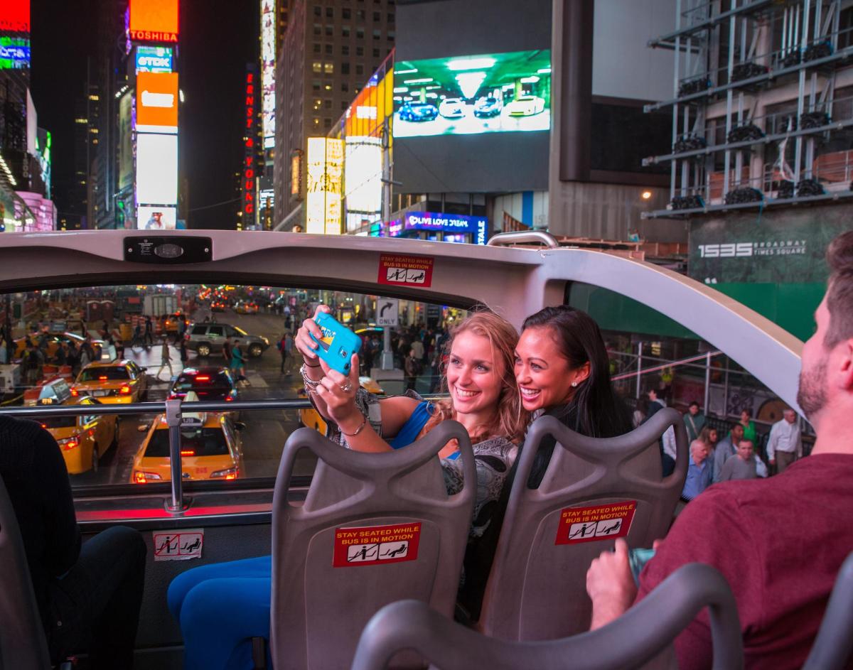 a couple of women sitting in a bus