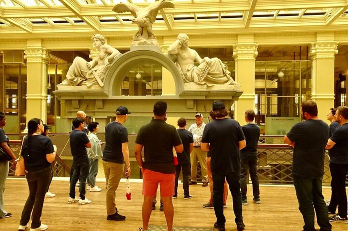 a group of people standing in front of a statue