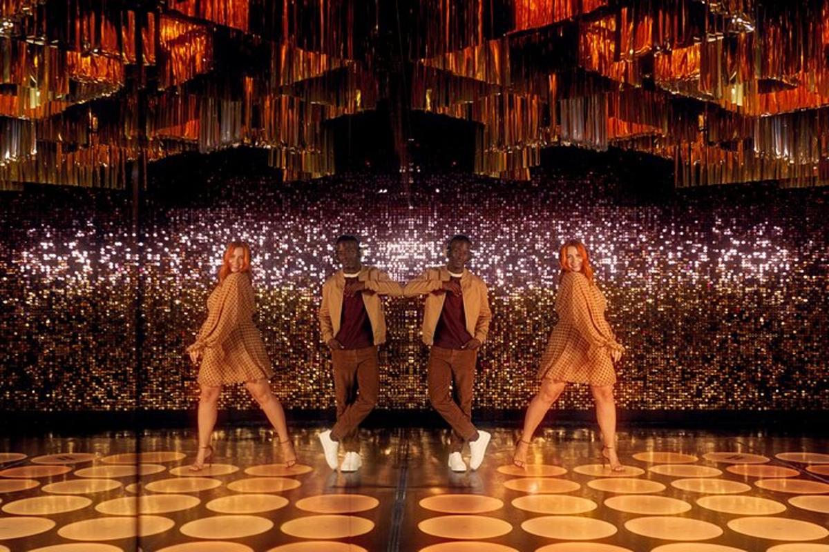 a group of people on a stage with lights