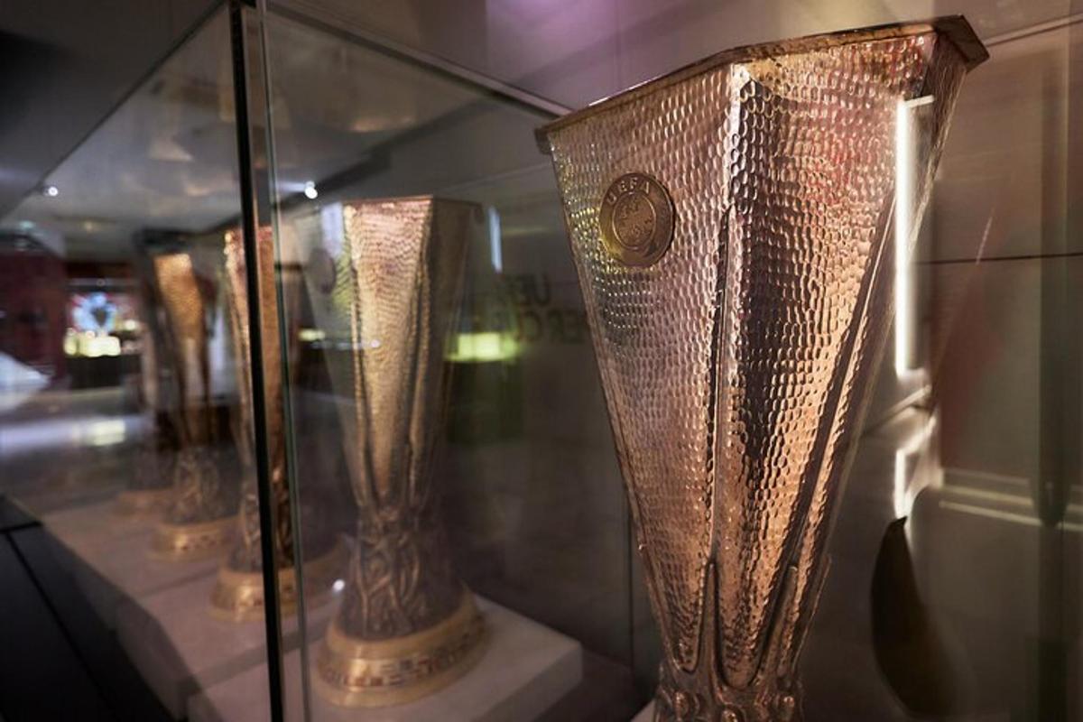 a group of vases in a glass display case