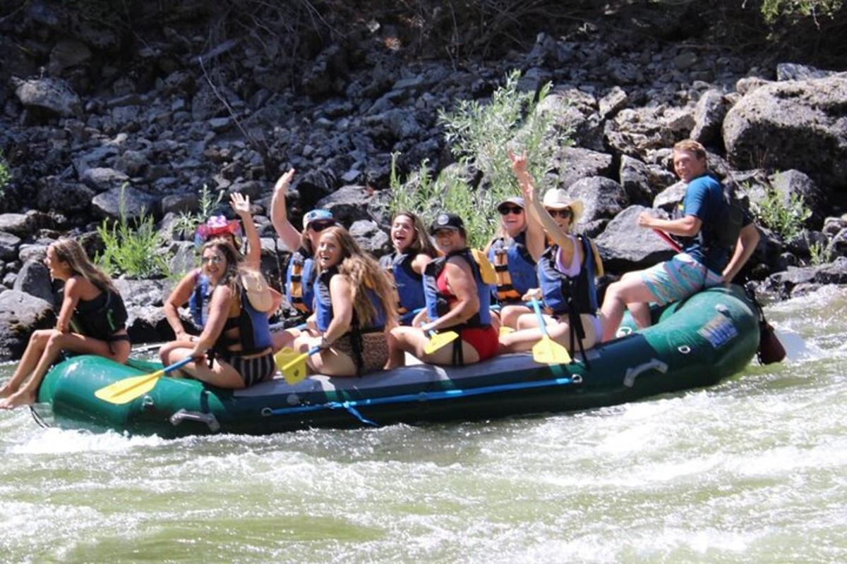 a group of people on a raft in the river
