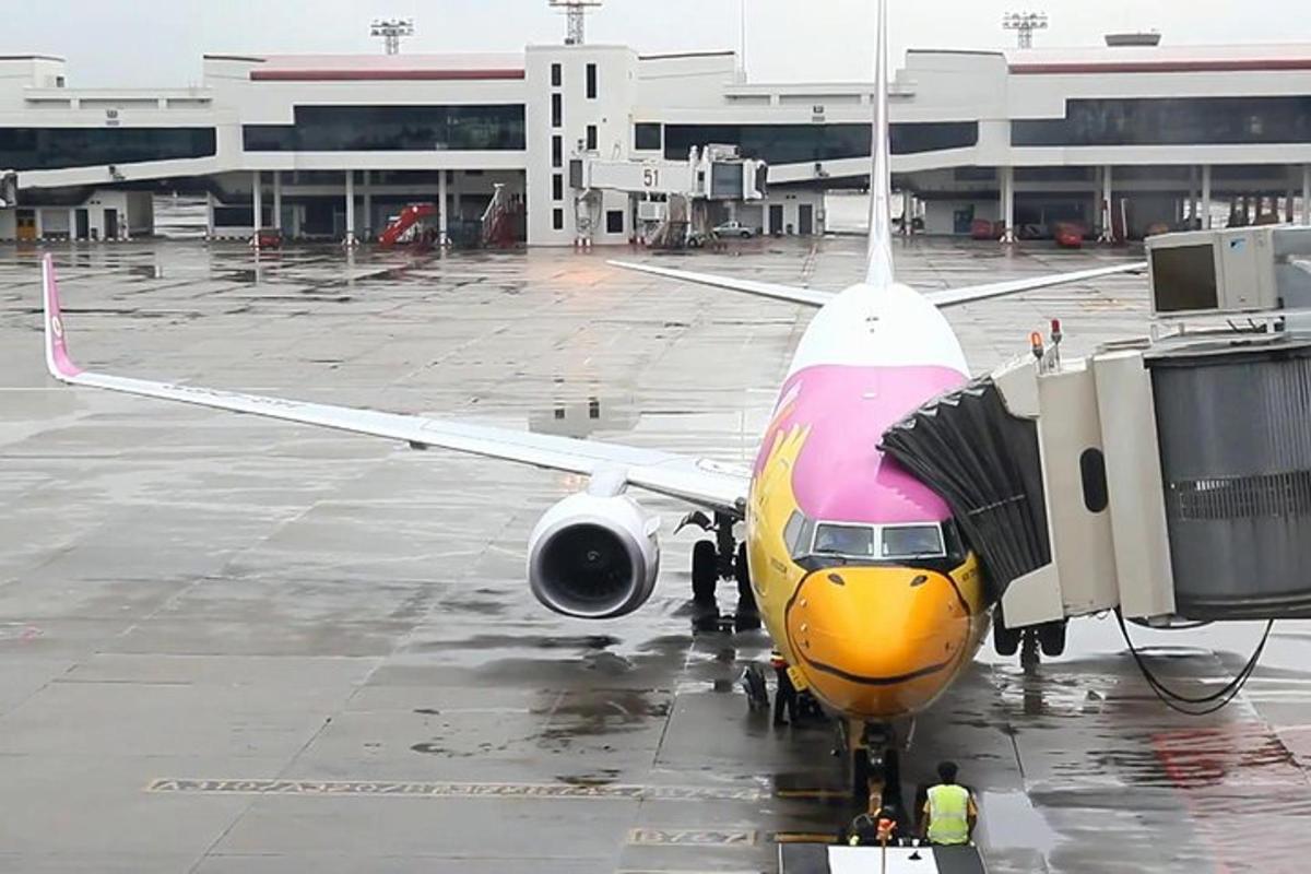 an airplane is parked on the runway at an airport