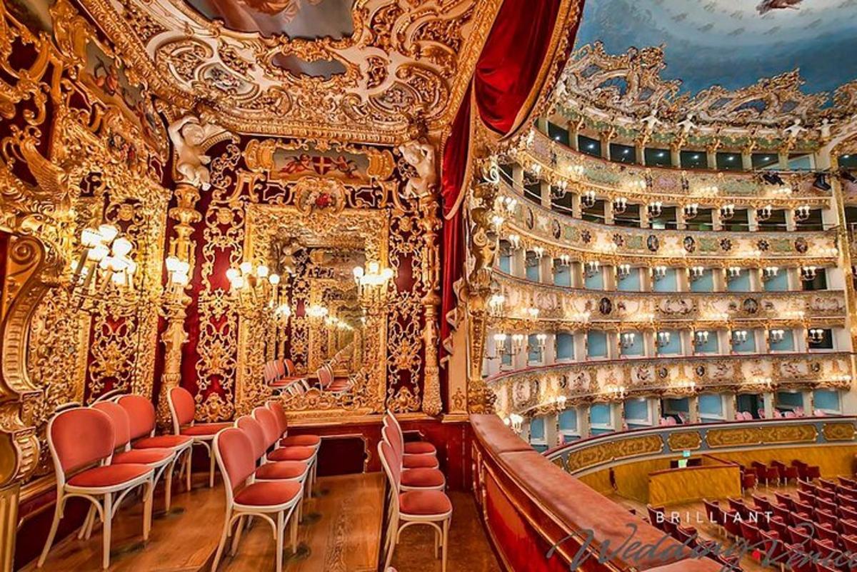 an ornate theatre with chairs and a stage