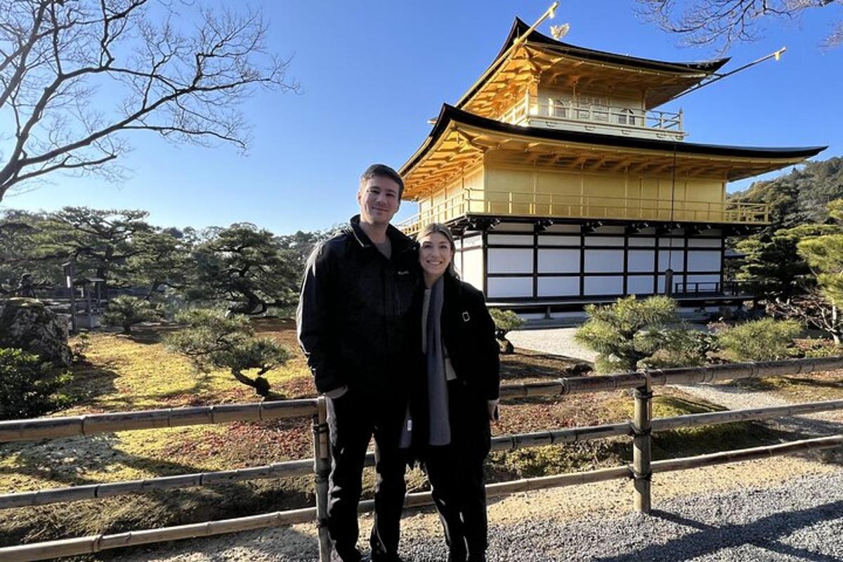a man and woman standing in front of a building