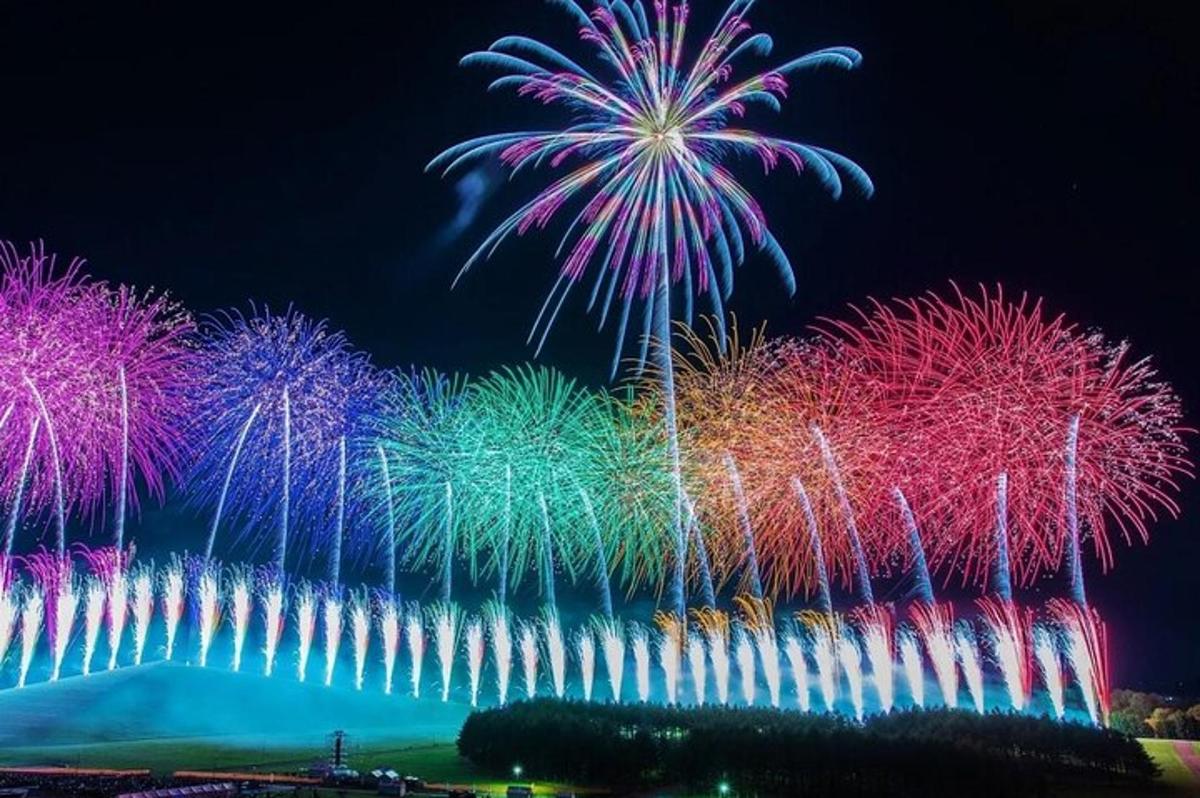 a fire show with colorful fireworks in the sky