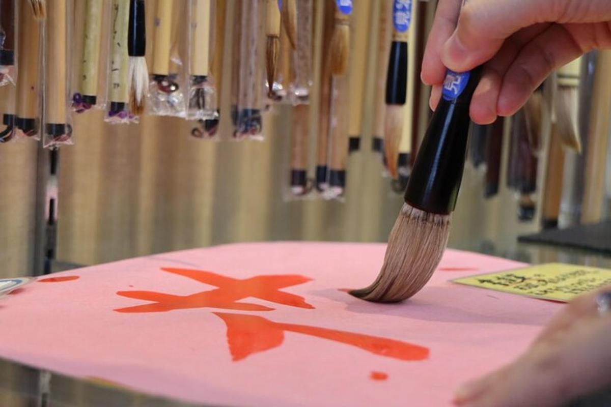 a person holding a brush on top of a table