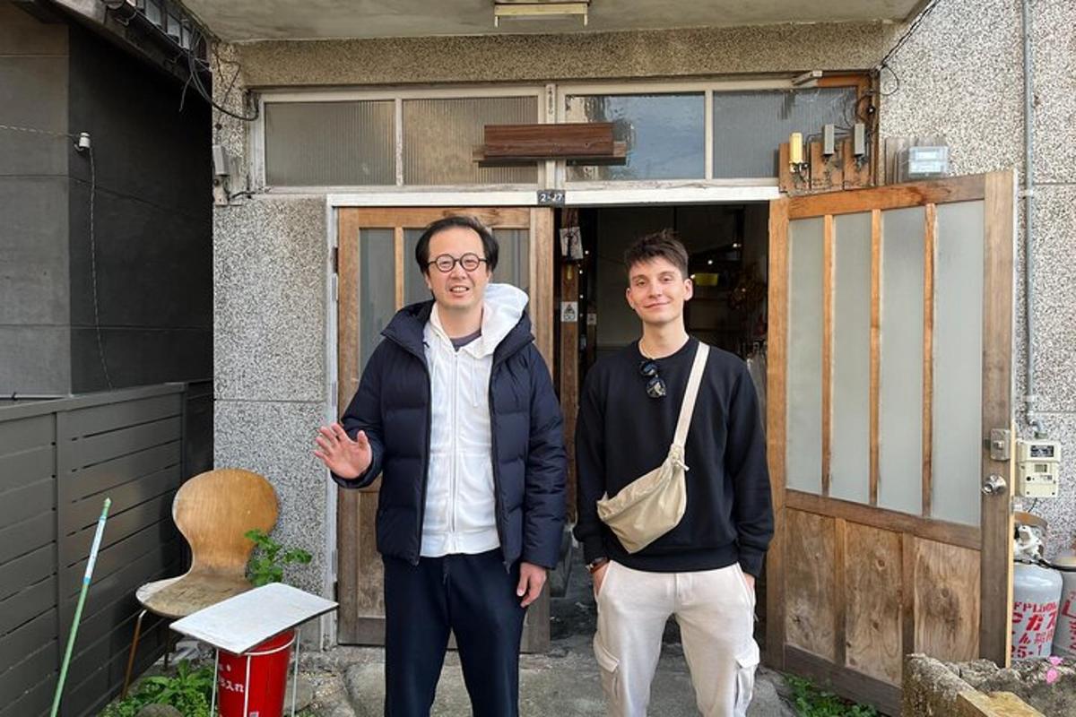 two men standing in front of a door