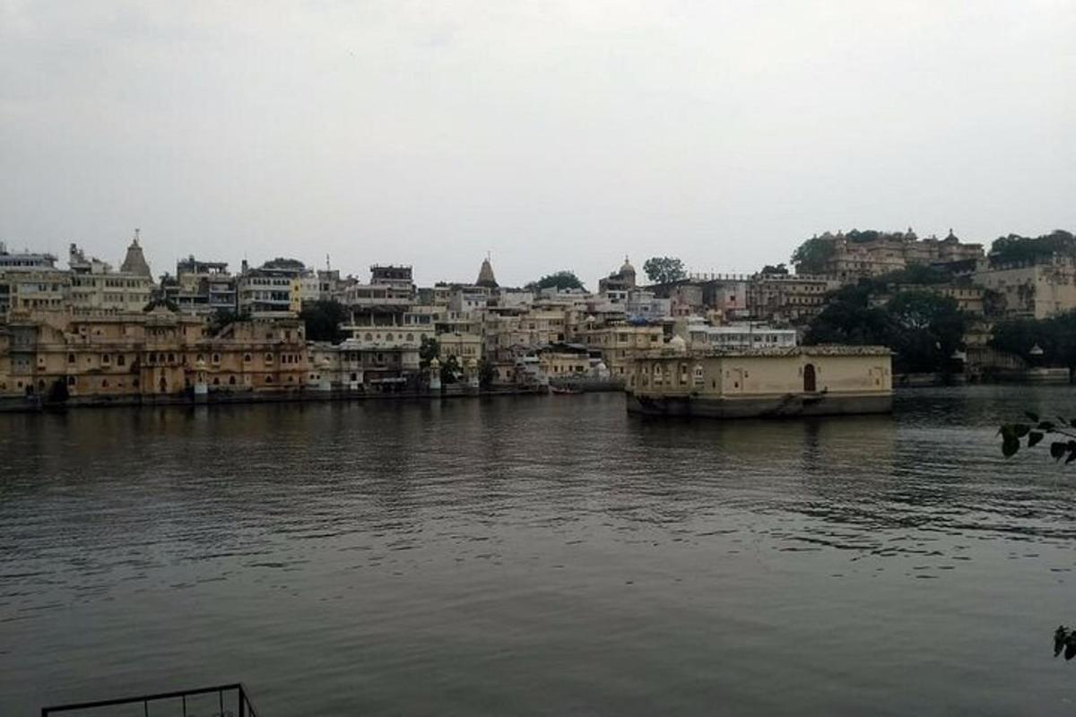 a view of a river with houses and a city