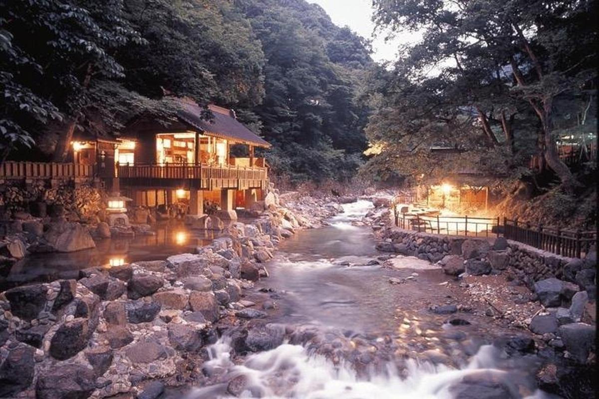 a river in front of a building with