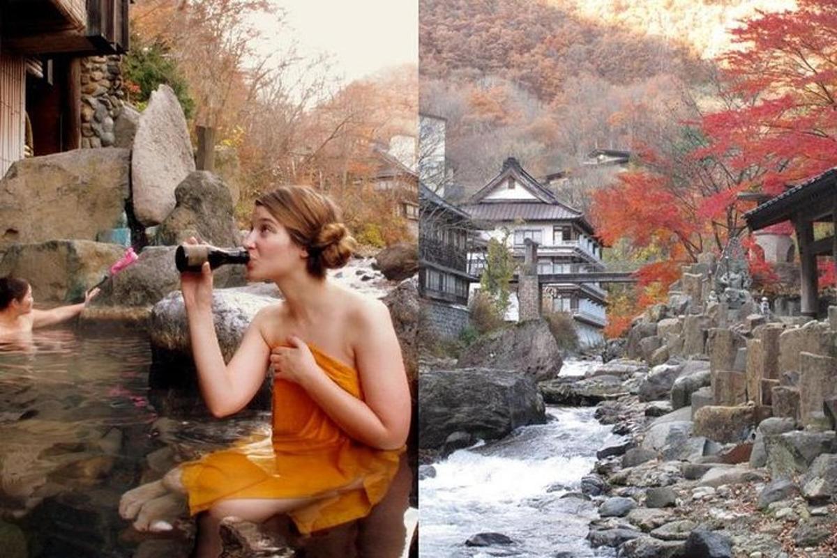 a woman is sitting in a river singing into a microphone
