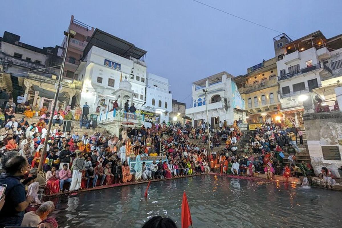 a crowd of people standing around a pool of water