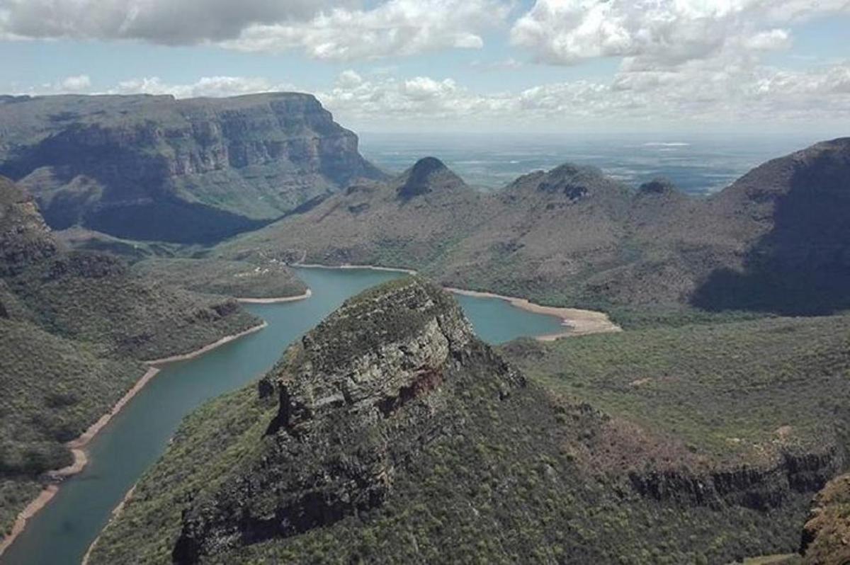 an aerial view of a river in a canyon