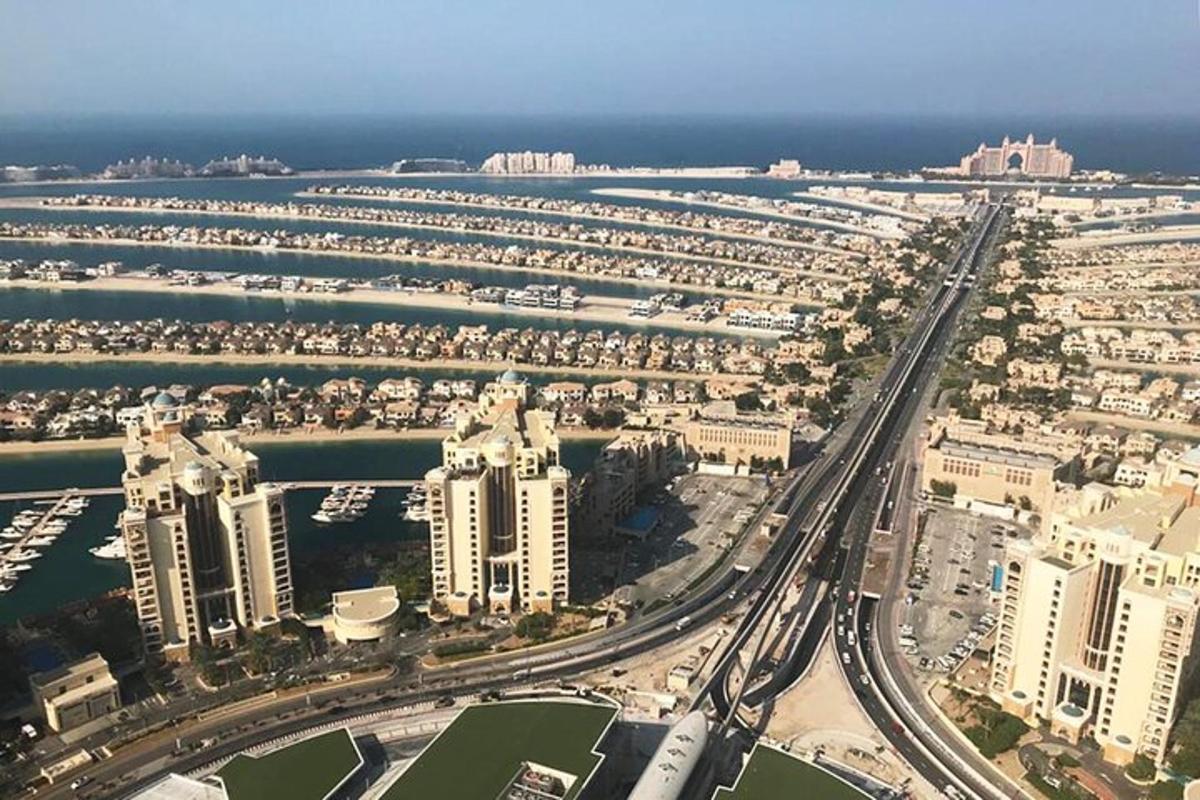 an aerial view of a city with tall buildings